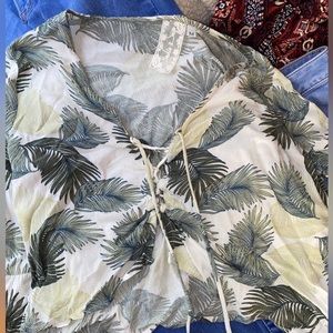 Sadie & Sage cropped top. Bell sleeves and tie going all the way down the front.